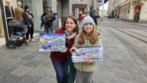 Zwei Kundschaften zeigen den Kalender